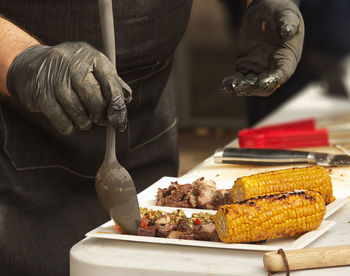 Midsection of person preparing food