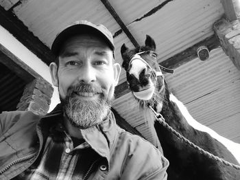 Low angle portrait of man with horse