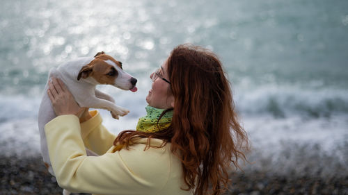 Side view of woman with dog