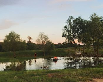 Scenic view of calm lake against trees