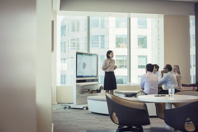 Business people listening to presentation