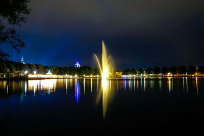 Reflection of illuminated buildings in water