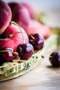 Close-up of cherries and peaches on table