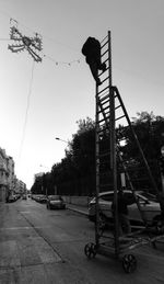 Low angle view of electricity pylon against sky