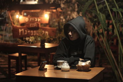 Portrait of woman sitting at restaurant