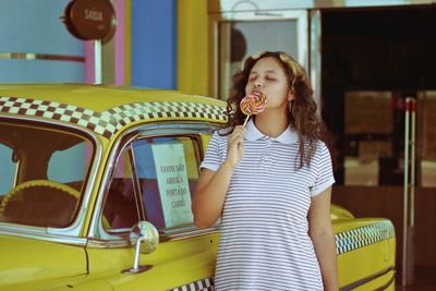 Woman eating lollipop