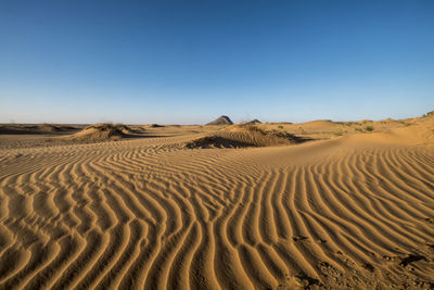 Shapes, lines and patterns at great dune in the sahara desert in the afternoon light