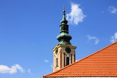 Low angle view of statue against blue sky