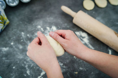 Cropped image of person hand on table