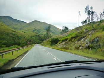 Road passing through forest