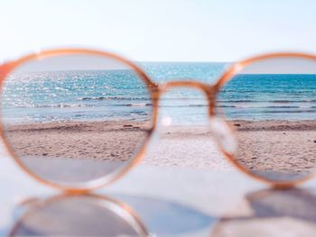 Close-up of sea shore against clear sky