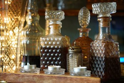 Close-up of decanters on table