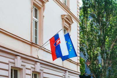 Low angle view of flag against building