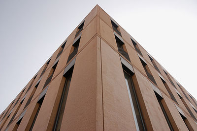 Low angle view of skyscraper against clear sky