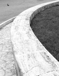 High angle view of footpath by wall