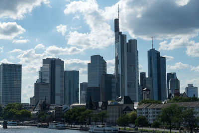 Modern buildings in city against sky