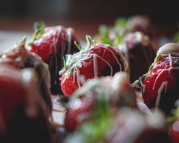 Strawberries decorated with gold glitter and white chocolate 