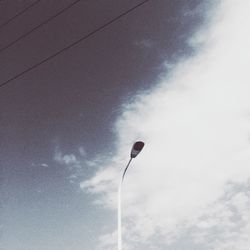 Low angle view of street light against sky
