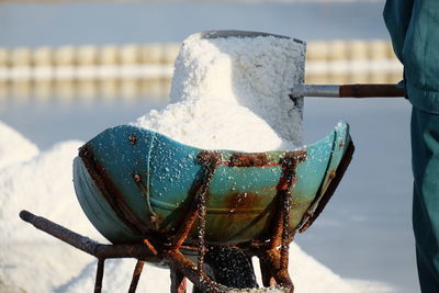 Close-up of salt on wheelbarrow