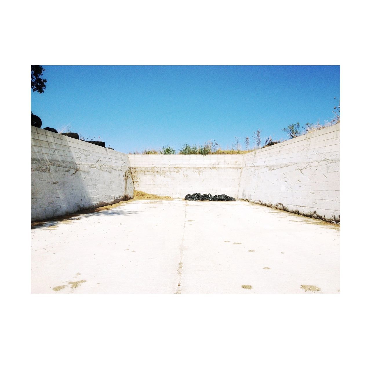 transfer print, built structure, architecture, auto post production filter, clear sky, building exterior, history, copy space, wall - building feature, stone wall, day, sky, stone material, outdoors, famous place, no people, travel destinations, wall, sunlight, the way forward