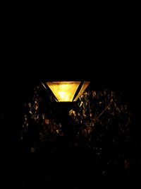 Low angle view of illuminated lamp