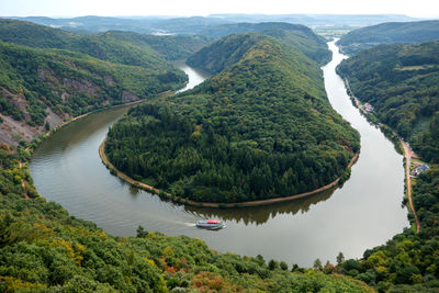 High angle view of river amidst mountains