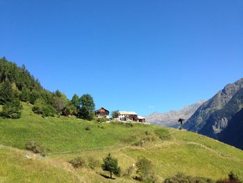 Scenic view of landscape against clear blue sky