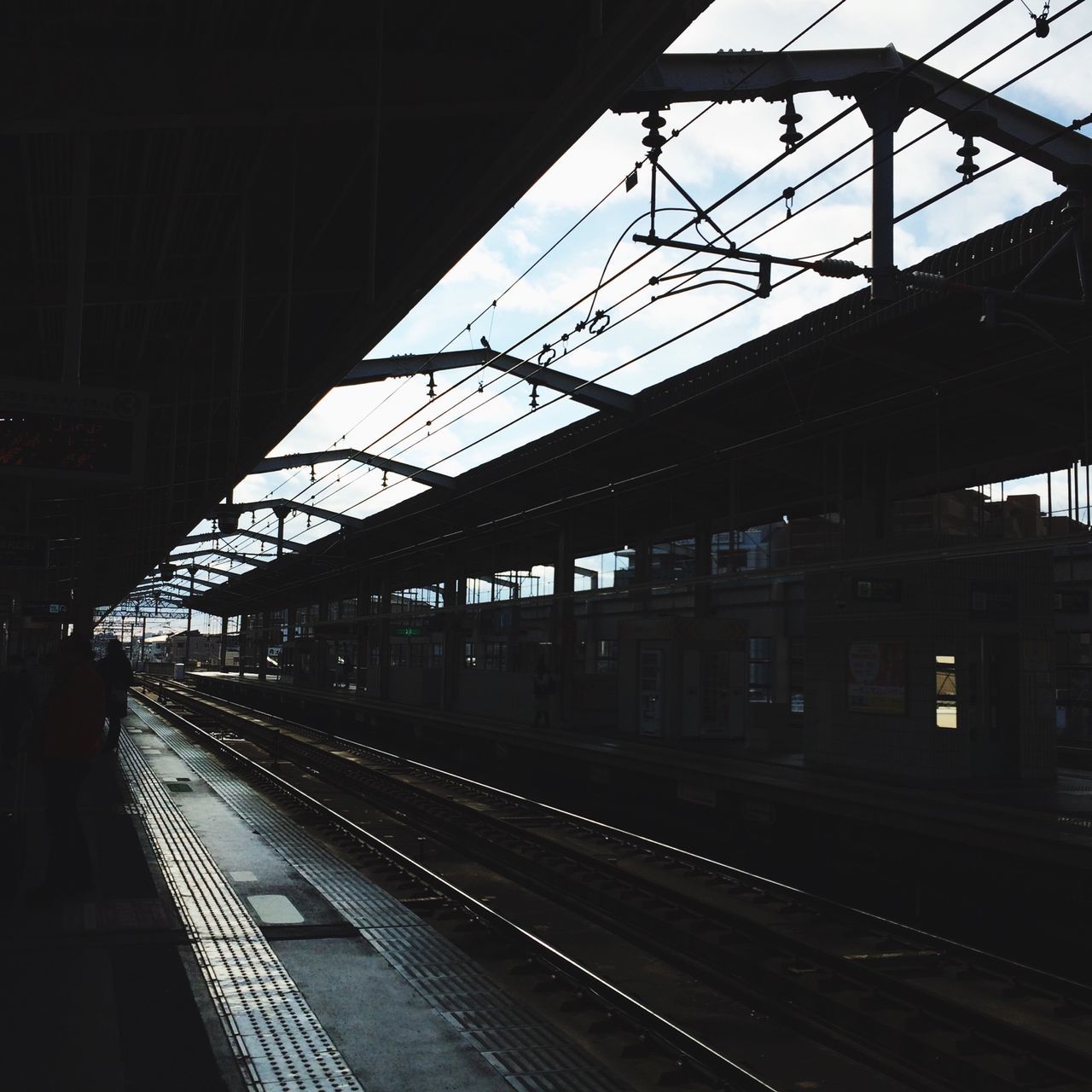 railroad track, rail transportation, railroad station, transportation, public transportation, railroad station platform, architecture, train - vehicle, built structure, indoors, train, passenger train, railway station, railway track, travel, public transport, illuminated, mode of transport, station, diminishing perspective