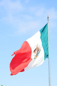 Low angle view of flag against the sky