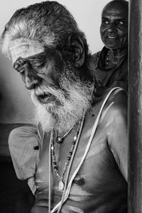 Portrait of man sitting outdoors