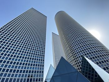 Low angle view of modern buildings against clear sky in city