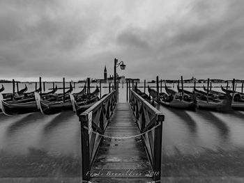 Pier over sea against sky