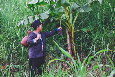 Full length of man standing in field