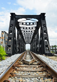 View of railroad tracks against cloudy sky