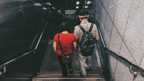 Rear view of people on steps