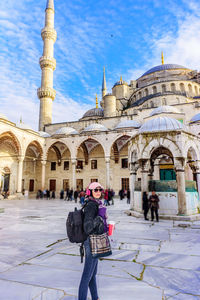 Woman standing against hagia sophia museum