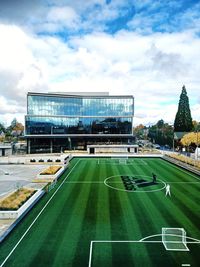 View of soccer field against cloudy sky