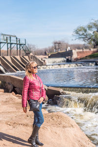 Full length of woman standing on rock