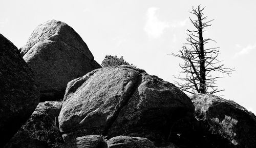 Low angle view of rock formation against sky