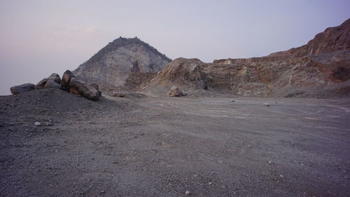 Rock formations on land against sky