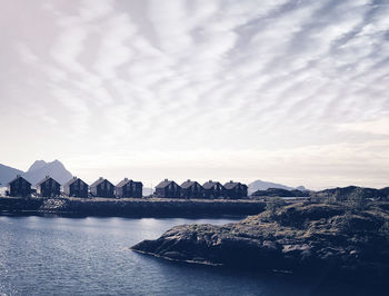 Panoramic view of sea and houses against sky