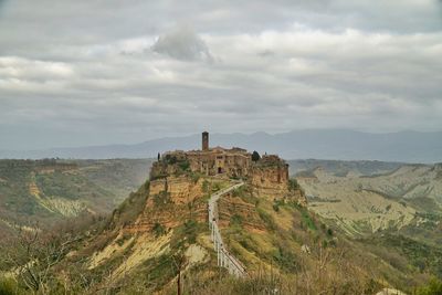 Scenic view of landscape against cloudy sky