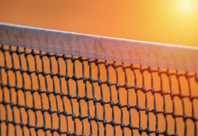 Close-up of sport net during sunset