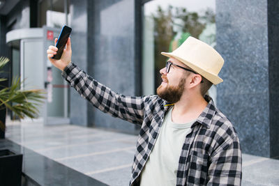 Side view of woman using mobile phone