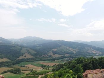 Scenic view of landscape and mountains against sky