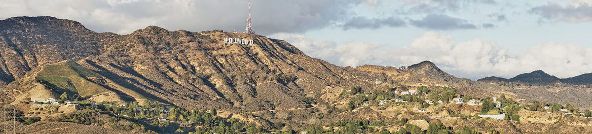 Panoramic view of mountains against cloudy sky