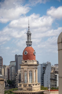 Buildings in city against sky