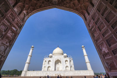 Low angle view of historical building against blue sky