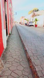 Cobblestone street against sky