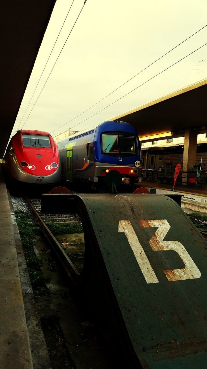 TRAIN ON ROAD IN CITY